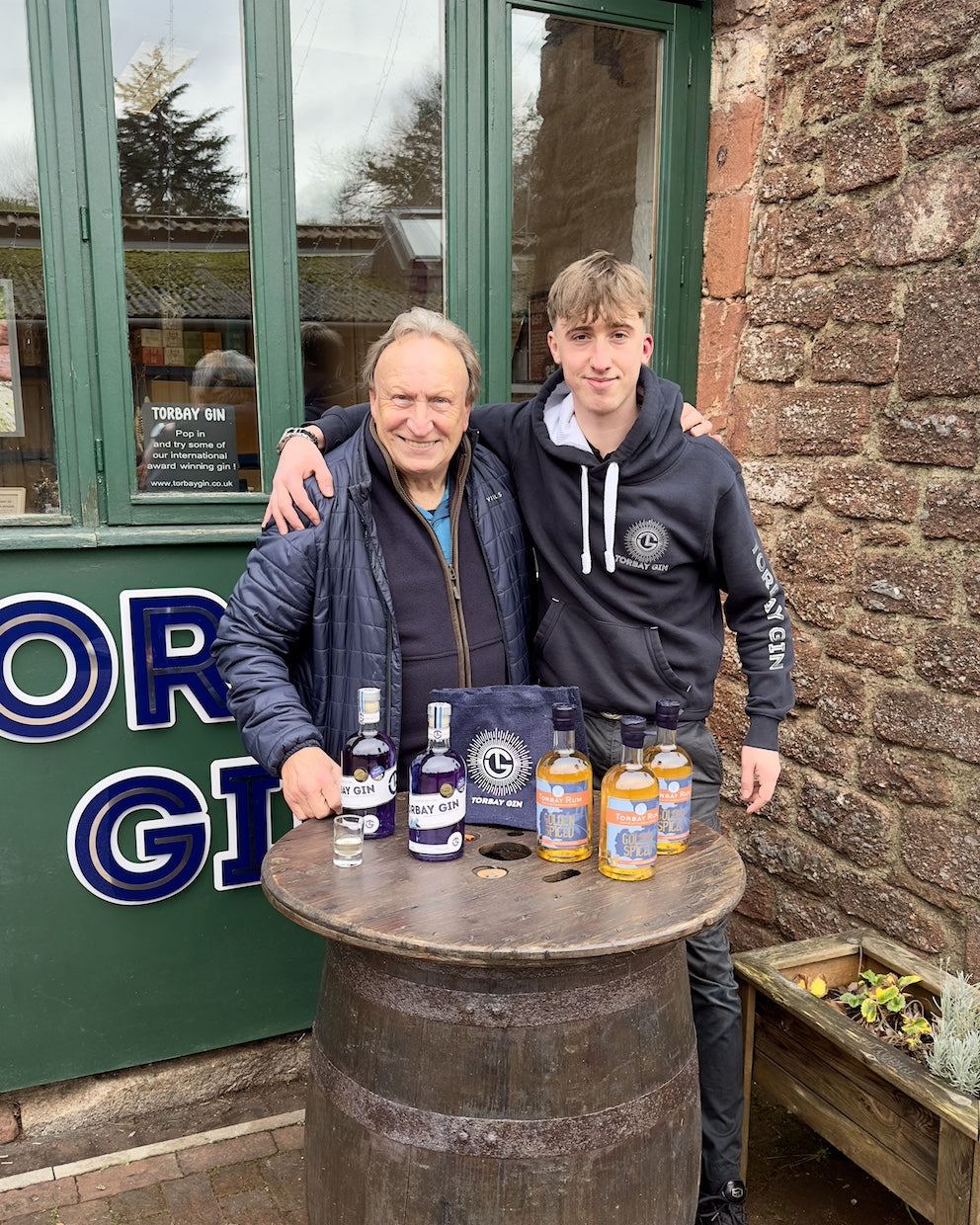 Neil Warnock and Logan from Torbay Rum in front of distillery