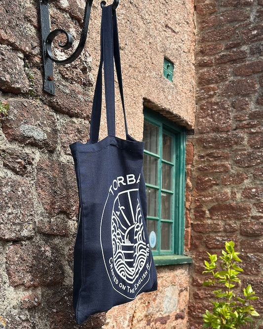 blue torbay rum tote bag hanging in cockington
