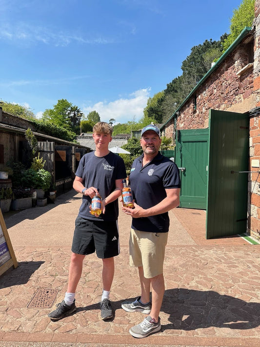 Logan and Brendon from above water holding torbay rum