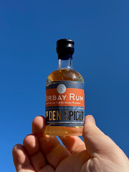 Mini Golden Spiced rum with a sunny sky