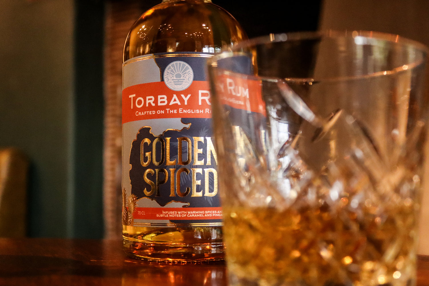 Close up shot of torbay rum golden spiced at the drum inn with tumbler glass