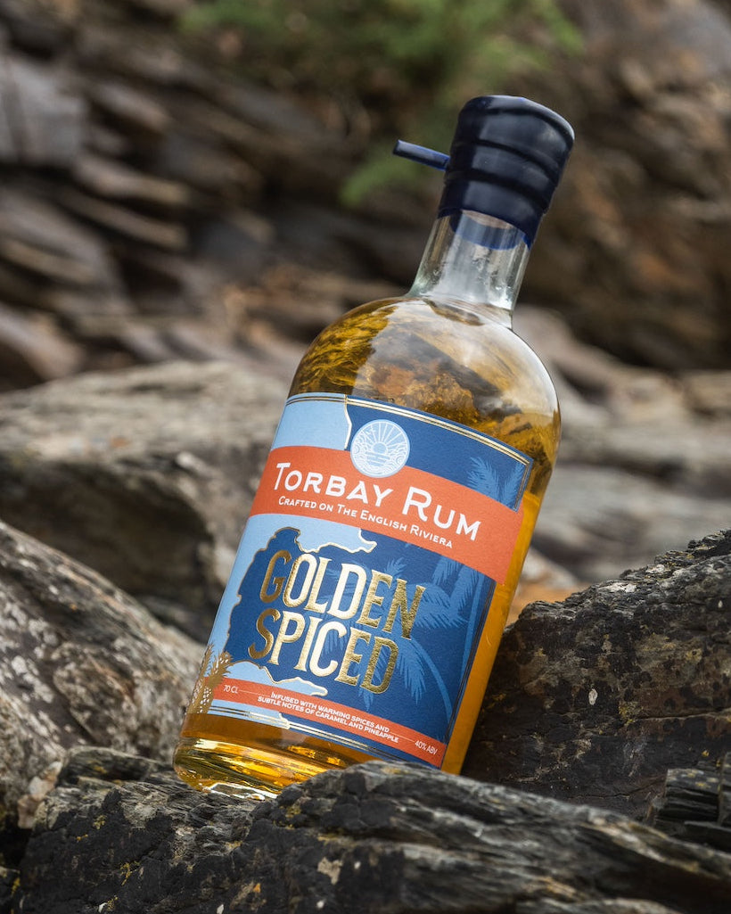Golden Spiced rum at meadfoot beach on the rocks